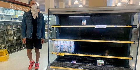 Empty shelves of diary products are seen at a supermarket in Sydney. (Photo | AP)