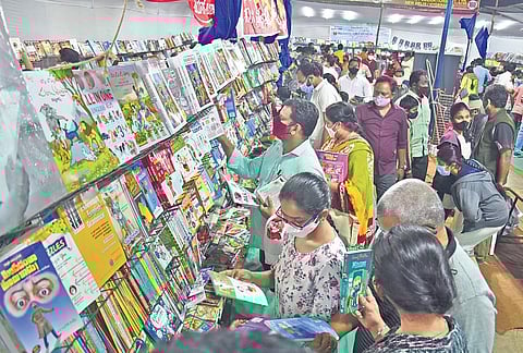 People looking through books on the last day of the 32nd Book Festival at PWD Grounds in Vijayawada on Tuesday, Jan 11, 2022. (Photo | EPS, P Ravindra Babu)