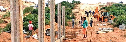 Construction of boundary wall of the proposed JSW steel plant underway in mahala village (Photo | Express)