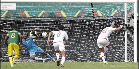 Mali's goalkeeper Ibrahima Mounkoro, left, dives for the ball kicked by Tunisia's Wahbi Khazri, far right, during the African Cup of Nations 2022 (Photo | AP)