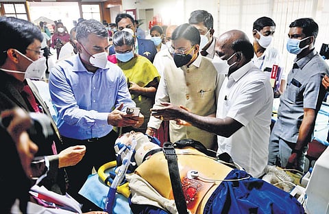 Union Health Minister Mansukh Mandaviya watches a demonstration along with State Health Minister Ma Subramanian during his visit to the Covid war room at DMS campus. | Debadatta Mallick