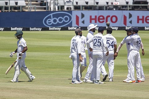 The Indian team celebrates the wicket of South African batsman Keegan Peterson, left, during the fourth day of the third and final test match between South Africa and India. (Photo | AP)