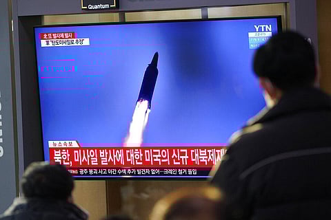 People watch a TV screen showing a news program reporting about North Korea's missile launch with a file image, at a train station in Seoul, South Korea. (Photo | AP)