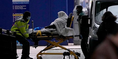 A patient is pushed on a trolley outside the Royal London Hospital in the Whitechapel area of east London.(Photo | AP)