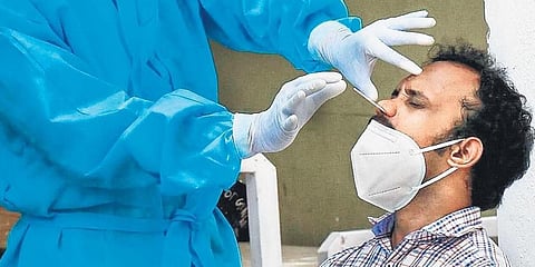 A man gives samples for RT-PCR test. (Photo | EPS)