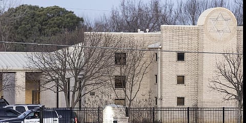 Police stand in front of the Congregation Beth Israel synagogue, Sunday, Jan. 16, 2022, in Colleyville, Texas.(Photo | AP)