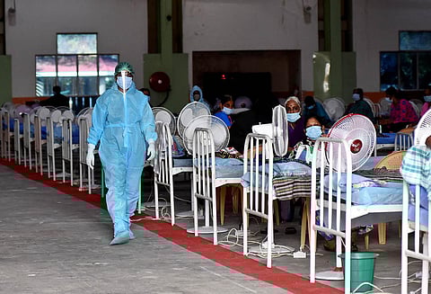 Doctors in PPE suits tend to patients at a Covid Care Centre in Chennai on Sunday. (Photo | Ashwin Prasath, EPS)