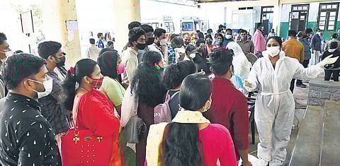 People wait in queue to register for Covid tests at Thiruvananthapuram General Hospital amid a rise in test positivity rate in the capital | Vincent Pulickal