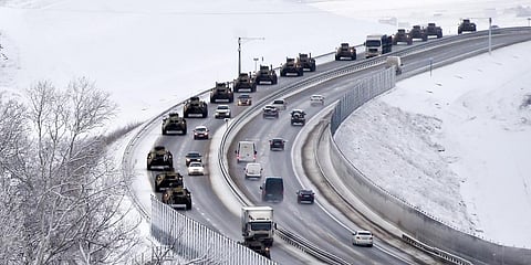 A convoy of Russian armored vehicles moves along a highway in Crimea, Tuesday, Jan. 18, 2022. (Photo | AP)