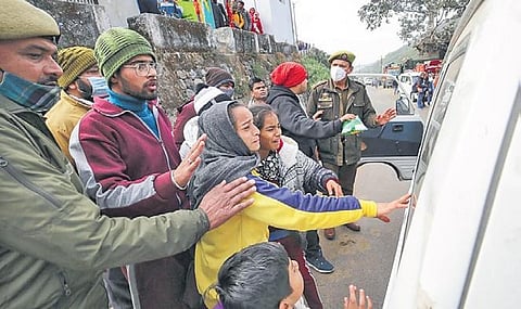Relatives search frantically for a missing devotee at Darshani Deodi of Mata Vaishno Devi shrine after the stampede on Saturday morning | Pti