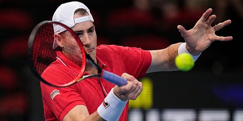 United States' John Isner hits a forehand to Canada's Brayden Schnur match at the ATP Cup tennis tournament in Sydney. (Photo | AP)