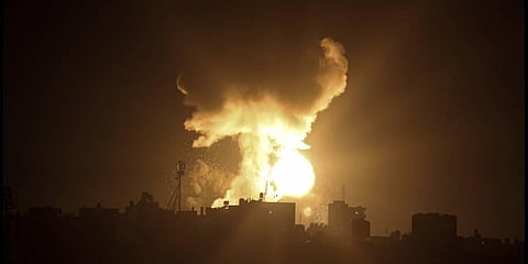 An explosion caused by Israeli airstrikes is seen in the town of Khan Younis, southern Gaza Strip. (Photo | AP)