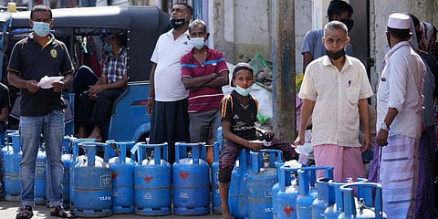FILE- Sri Lankans wait in a queue for a refill of their cooking gas cylinders in Colombo, Sri Lanka, Tuesday, Jan. 4, 2022. (Photo | AP)