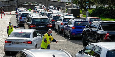 Traffic marshals direct vehicles at a drive-thru COVID-19 testing clinic at Bondi Beach in Sydney. (Photo | AP)