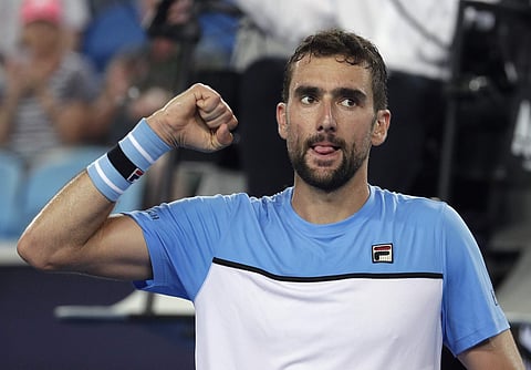 Croatia's Marin Cilic celebrates after defeating Australia's Bernard Tomic at the Australian Open in Melbourne, Australia on Jan. 14, 2019. (File Photo | AP)