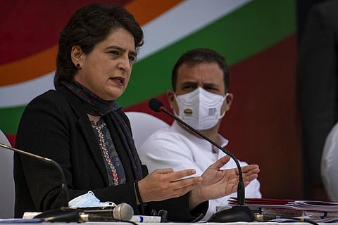 Congress party General Secretary Priyanka Gandhi Vadra, left, flanked by her brother and party leader Rahul Gandhi, speaks during the release of the Congress party's manifesto. (Photo | AP)