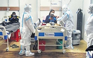 Medics attend to patients at a Covid-19 care centre in CWG Village (Photo | ENS, Parveen Negi)