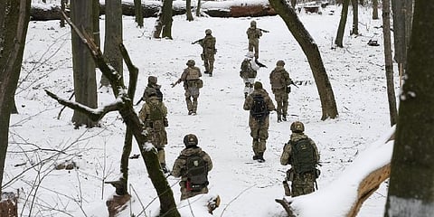 Members of Ukraine's Territorial Defense Forces, volunteer military units Dozens of civilians have been joining Ukraine's army reserves in recent weeks amid fears about Russian invasion. (Photo | AP)