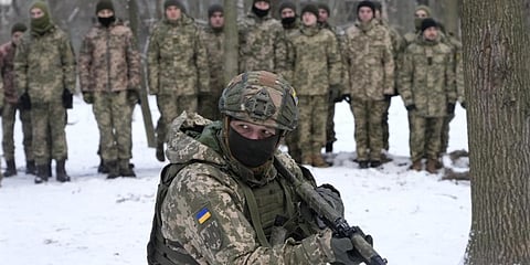 An instructor trains volunteer military units of the Armed Forces,Dozens of civilians have been joining Ukraine's army reserves in recent weeks amid fears about Russian invasion.(Photo | AP)