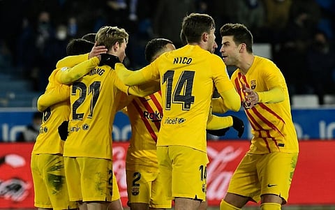 Barcelona's Frenkie de Jong, second left, celebrates after scoring his side's opening goal during the La Liga soccer match (Photo | AP)