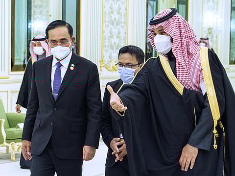 In this photo released by the Saudi Royal Palace, Saudi Crown Prince Mohammed bin Salman, right, welcomes Thai Prime Minister Prayuth Chan-ocha, at the royal palace in Riyadh, Saudi Arabia. (AP)