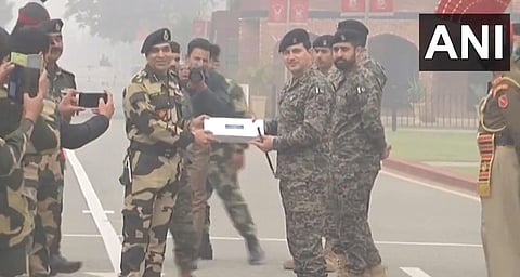 Pakistani Rangers and BSF officials exchange sweets on 73rd Republic Day. (Photo| ANI)