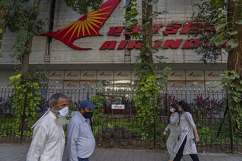 People walk past Air India headquaters in Mumbai, India, Thursday, Jan. 27, 2022. (Photo | AP)