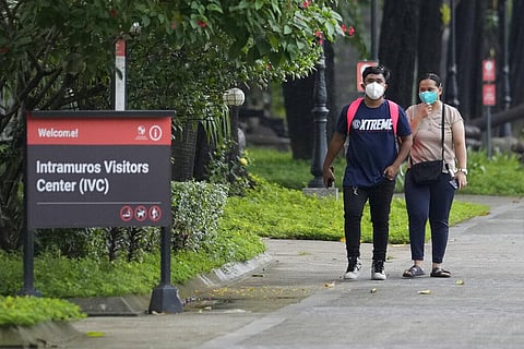 Tourists walk inside Fort Santiago at the walled-city of Intramuros in Manila, Philippines. (Photo | AP)
