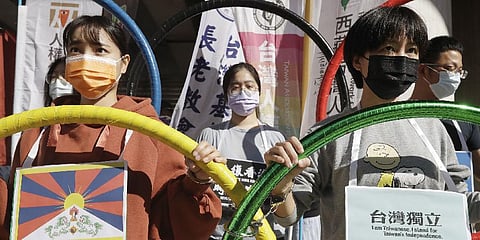 Human rights groups gather to raise their slogan calling for a boycott of the Beijing Winter Olympics 2022, in Taipei, Taiwan, Wednesday, Jan. 26, 2022. (File Photo | AP)