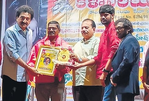 Mallavvarapu Chinnaiah receives an award; (below) display of awards he has received