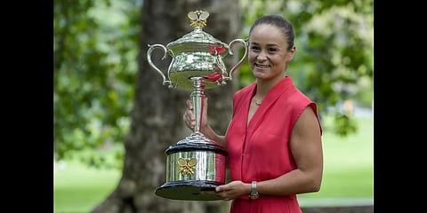 Ash Barty of Australia poses with the Daphne Akhurst Memorial Cup at a park the morning after defeating Danielle Collins.(Photo | AP)