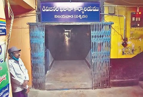 An employee at divisional treasury office at Governorpet in Vijayawada on Sunday. No one else turned up at the office for work till 11.35 am I P Ravindra Babu