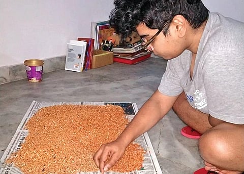 Deepthi K drying discarded flowers. (Photo| EPS)