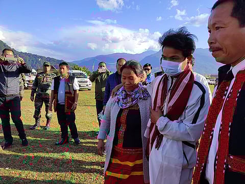 Miram Taron seen with his mother following his arrival at Tuting.
