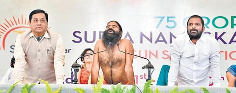 Union Minister Sarbananda Sonowal, Baba Ramdev and TS Sports Minister V Srinivas Goud see doing the Bhujanga Asana at Kanha Shanti Vanam on Monday