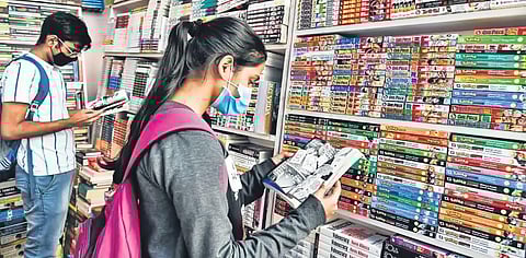 People check out Manga comics at the Hyderabad Book Fair (Photo | EPS, Vinay Madapu)