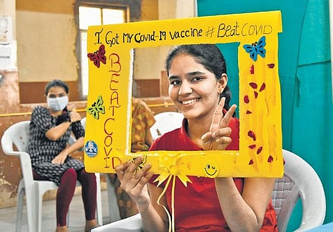A young girl poses for a picture after taking Covid vaccine at Fever Hospital in Hyderabad on Monday, Jan 3, 2022. (Photo | EPS, Vinay Madapu)