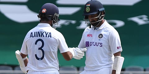 India's Cheteshwar Pujara (R) and Ajinkya Rahane on day 3 of the second Test against South Africa at the Wanderers Stadium in Johannesburg. (Photo| Twitter)