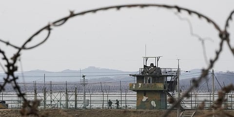 South Korean army soldiers patrol along the barbed-wire fence in Paju, near the border with North Korea, South Korea.(Photo | AP)