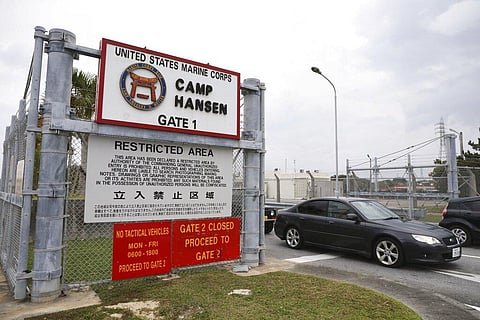 A vehicle leaves the U.S. Marine Corps' Camp Hansen, in Kin, Okinawa prefecture, southern Japan (Photo| AP)