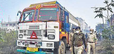 Police officials inspect the site where the accident happened in Surat. (Photo | PTI)