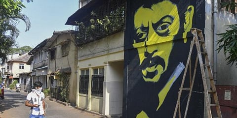 A man walks past a mural of late Bollywood actor Irrfan Khan in Mumbai. (File photo| AFP)