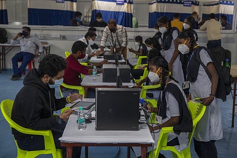 Indian school girls register to receive vaccination for COVID-19 at a vaccination center in Mumbai, India, Monday, Jan. 3, 2022. (Photo | AP)