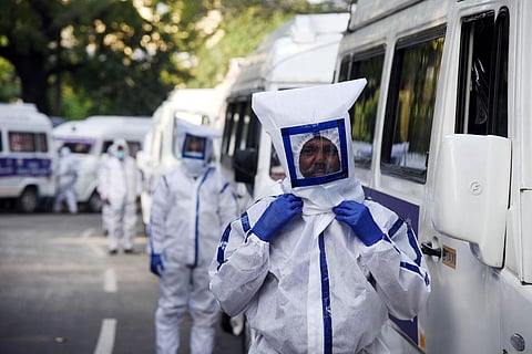 An ambulance staff poses next to new ambulances flagged off by CM M K Stalin on Thursday. (Photo | R Satish Babu,EPS)