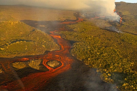 This photo released by the the National Galapagos Park communications office shows, from above, lava from the eruption of Wolf Volcano on Isabela Island, Galapagos Islands. (Photo | AP)