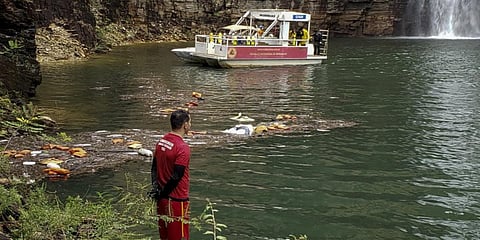 irefighters during a rescue operation after a large rock fragment plunged onto several tourist boats at the canyons of Furnas Lake in Brazil. (Photo| AFP)
