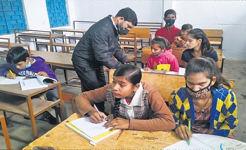 Hariom Jamini teaching Braille to students who are visually impaired like him at a government school in Sehore district. (Photo| EPS)