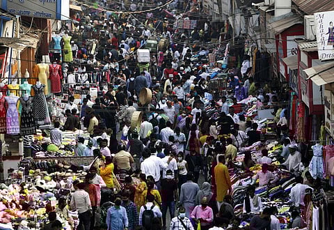 Indians wearing face masks as a precaution against the COVID-19, crowd a market, in Mumbai, India, Friday, Jan. 7, 2022. (Photo | AP)