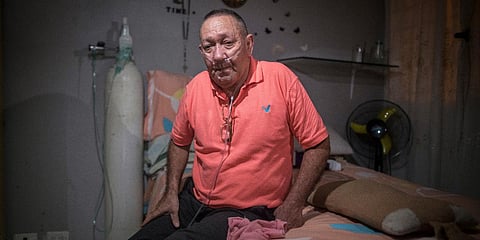 Victor Escobar, who suffers from chronic obstructive pulmonary disease, sits at his home during an interview in Colombia. (Photo| AP)