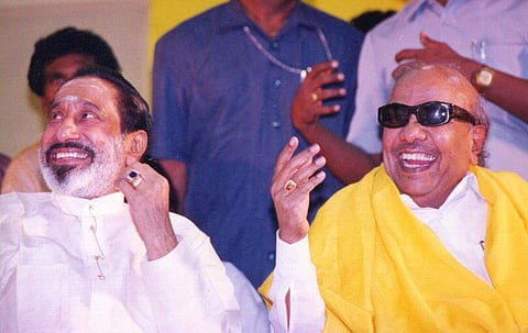Former chief minister M Karunanidhi with Actor Sivaji Ganesan enjoying a joke during a function. (EPS)